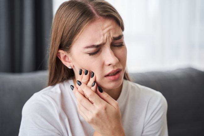 Awful,Toothache.,Frustrated,Young,Women,Suffering,From,Toothache,While,Sitting Toothache Relief in Hamilton, OH Hamilton Riverside Dentistry