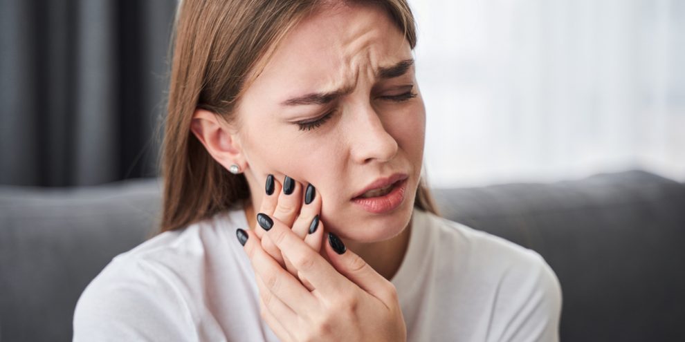 Awful,Toothache.,Frustrated,Young,Women,Suffering,From,Toothache,While,Sitting Toothache Relief in Hamilton, OH Hamilton Riverside Dentistry